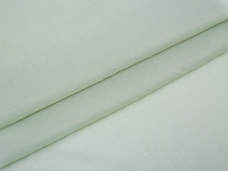 Hur förbättrar polyester -interlining komforten med kläder genom andningsförmåga?